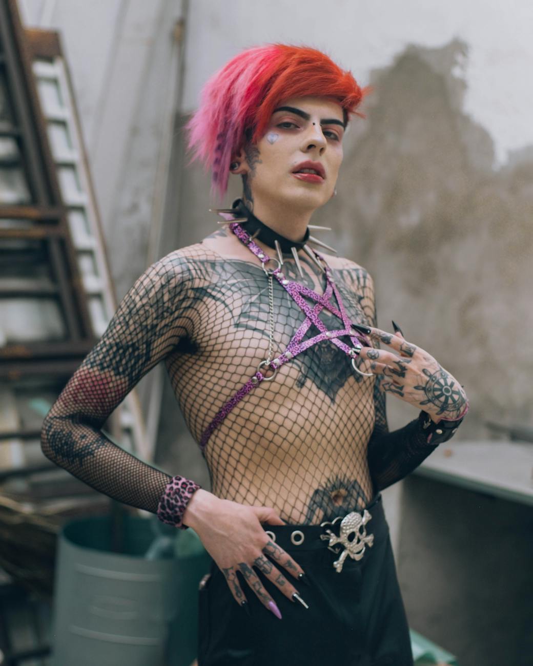 portrait of a model with tattoos and red hair