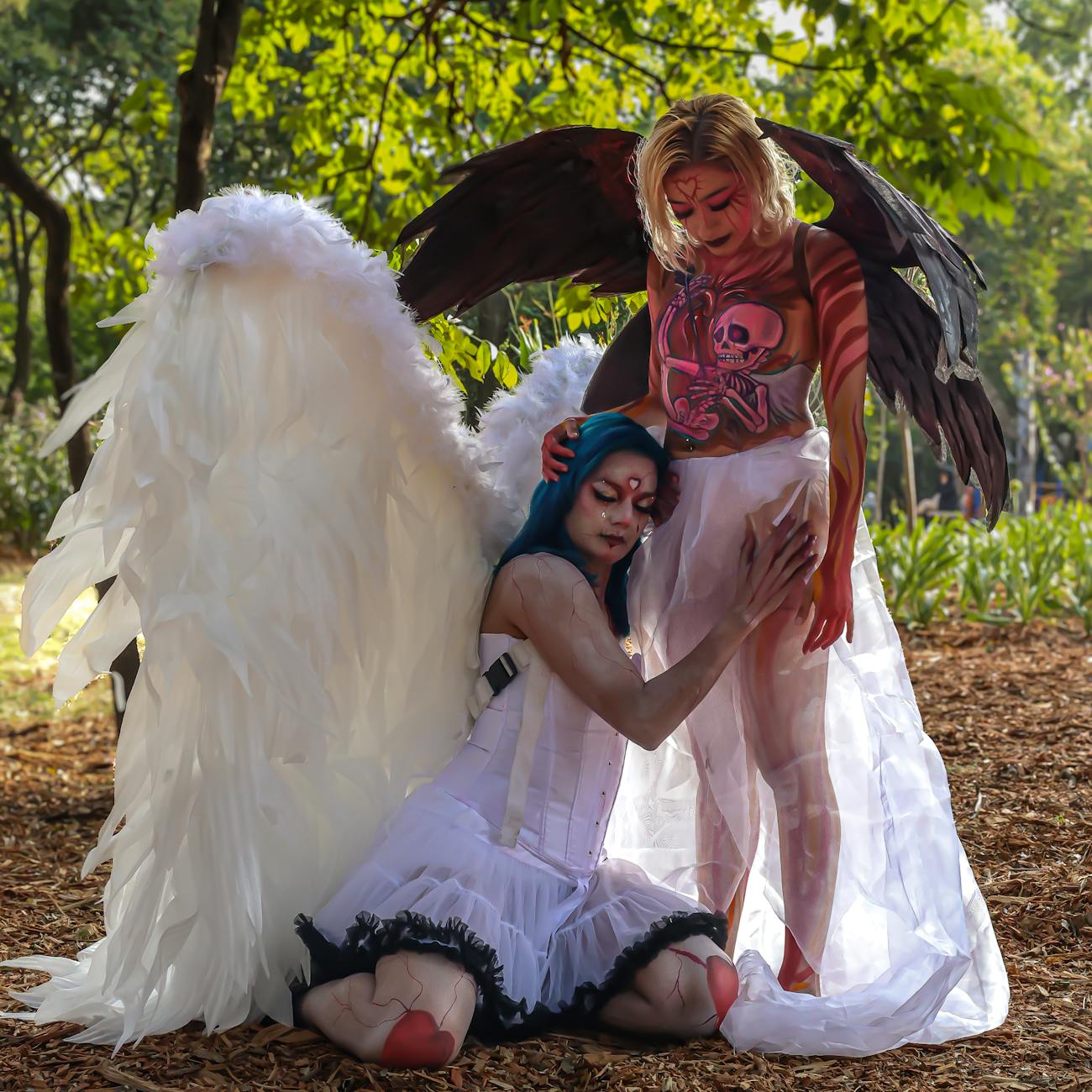 women in cosplay costumes with angel wings